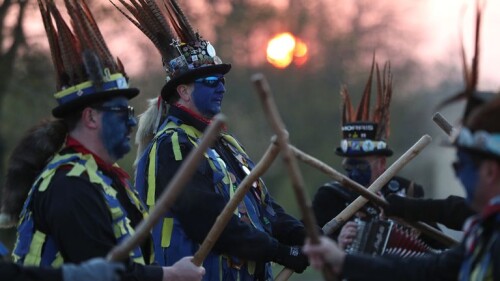 Morris dancers ditch black face paint and swap it for blue following racism concerns.

The tradition is believed to have derived from poor farm workers in the 1400s using soot to disguise themselves so they could beg.

Members of the Hook Eagle Morris Men perform outside the Shack Cafe near to Hook in Hampshire as they see in the May Day dawn. It is the first time they have been able to perform together since January 2020 and is the first time they have performed in their new Blue face paint. 

Morris dancers have swapped their black face paint over racism concerns
A group of morris dancers in Hampshire have swapped their traditional black face paint for blue, following concerns over racism.

The Hook Eagle Morris Men performed near the village of Hook in Hampshire on Saturday to mark May Day dawn, in their first show since January 2020.

Last June, cross-county group the Joint Morris Organisations put out a statement to ask dancing groups to stop the use of full-face black makeup in response to the Black Lives Matter movement in the wake of the death of George Floyd.

Members of the Hook Eagle Morris Men perform outside the Shack Cafe near to Hook in Hampshire as they see in the May Day dawn. It is the first time they have been able to perform together since January 2020 and is the first time they have performed in their new Blue face paint.

The practice of painting faces is thought to have originated in the 1400s
John Ellis, 70, who dances with the Hook Eagle Morris Men has been with the group since its inception as a church group in 1991, and describes the move as "by far and away the biggest if not really the only change we've experienced".

He added that other troupes around the UK has changed their face paint to different colours, with some opting for green, while a group in Kent now uses black and yellow stripes.

Mr Ellis says the tradition of using black face paint derived from when poor farm workers in the 1400s would use soot to disguise themselves so they could beg - which was illegal at the time.

That tradition "died out", according to Mr Ellis, but it was revived in the 1970s by border morris dancers, which was a type of dance that originated on the England-Wales border...