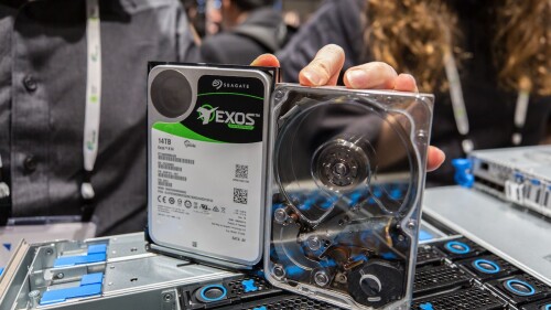 // Seagate's Exos 2X14 HDD can deliver a sustained transfer rate of 524MB/s //

Seagate has finally disclosed the official specs of its first dual-actuator hard disk drive (HDD) the Mach.2 Exos 2X14 and listed it on its website.

Although SSDs have now become the standard for business laptops and workstations, HDDs still have a place in data centers due to their ability to store large amounts of data relatively cheaply. However, Seagate's Mach.2 multi-actuator technology aims to speed up the rate at which HDDs can transfer data without sacrificing their storage capacity.

While traditional HDDs have one actuator with read/write heads, the company's Mach.2 drives have two in order to double both their sequential and random read/write speeds. Seagate has been working closely with Microsoft since the end of 2017 to develop its multi-actuator technology and based on the Mach.2 Exos 2X14's specs, its efforts have paid off.

The company's first Mach.2 drive has a sustained transfer rate of 524MB/s which is even faster than its Exos 15E900, making it the fastest HDD in the world right now.

Seagate Exos 2X14
Seagate's Exos 2X14 HDD has a capacity of 14TB but the drive is essentially two 7TB HDDs fused together in a hermetically sealed helium-filled 3.5inch chassis. It features a spindle speed of 7200 RPM, a 256MB multisegmented cache and a single-port SAS 12GB/s interface.

When plugged into a server in a data center, the host system will view the Exos 2X14 as two logical drives that can be addressed independently. The sequential read/write speeds of Seagate's new HDD are so fast that the drive can even rival some inexpensive SATA/SAS SSDs at a far lower cost-per-TB.

The drive's performance increase does come at the cost of higher power consumption though and the Exos 2X14 drive consumes 7.2w in idle mode and up to 13.5W under heavy load. This amount of power is higher than the 12W usually recommended for 3.5-inch HDDS but data centers can leverage Seagate's PowerBalance capability to reduce power consumption though this does come at the cost of 50 percent lower sequential read/write speeds and five to ten percent lower random reads/writes.

While Seagate's first Mach.2 HDD is now listed on its site, the drive is only available to select customers and won't be coming to the open market anytime soon. However, there is a possibility that the company's multi-actuator technology could eventually be found in other HDDs.

Src: TechRadar