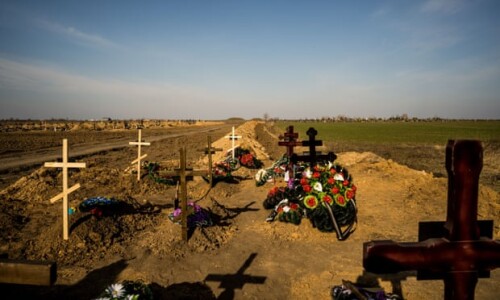 Burial site of soldiers who died in Mykolaiv, Ukraine. US president Joe Biden on Saturday appeared to call for those around his Russian counterpart, Vladimir Putin, to oust him. Photograph: Vincenzo Circosta/ZUMA Press Wire/REX/Shutterstock
Helen Livingstone
Sun 27 Mar 2022 00.12 GMT

--

Joe Biden has condemned Vladimir Putin as a “butcher” who could no longer stay in power in a historic speech in Poland. The US president appeared to urge those around the Russian president to oust him from the Kremlin, although US officials later said he had been talking about the need for Putin to lose power over Ukrainian territory and in the wider region.
As Biden spoke, Russian missiles rained down on Ukraine’s most pro-western city, Lviv, 40 miles from the Polish border. The timing of the attacks, only the third on west Ukrainian targets since the war began, and the closest to Lviv’s city centre and its residential areas, was clearly designed to send a message to the White House.
The Kremlin has again raised the spectre of the use of nuclear weapons in the war with Ukraine. Dmitry Medvedev, the previous president of Russia and deputy chairman of its security council, said Moscow could use them to strike an enemy that only used conventional weapons.
The comments prompted Volodymyr Zelenskiy, appearing by video link at Qatar’s Doha Forum, to warn that Moscow was a direct threat to the world. “Russia is deliberating bragging they can destroy with nuclear weapons, not only a certain country but the entire planet,” said the Ukrainian president.
Ukrainian flag being hung at Kherson City Hall
Kherson diary: ‘We have more deaths from lack of medication than from bullets’
Read more
Ukrainian troops are reporting that Russian forces are using white phosphorus against them near the eastern city of Avdiivka. While these reports could not be confirmed, Volodymyr Zelenskiy has told Nato leaders that Russia had used phosphorus bombs that had killed adults and children.
Russian forces temporarily seized Slavutych, a northern town close to the Chernobyl nuclear site on Saturday, and took prisoner its mayor, Yuri Fomichev. After failing to disperse the numerous protesters in the main square – despite using stun grenades and firing in the air – the Russian troops released the mayor and agreed to leave.
The Institute of Mass Media in Ukraine has documented 148 crimes against journalists and the media since the start of the Russian invasion. It said five journalists had been killed, six captured or kidnapped and seven wounded.
The Ukrainian parliament has confirmed a fresh Russian attack on the nuclear research reactor in Kharkiv. In a tweet, it quoted the State Nuclear Regulatory Inspectorate as saying: “It is currently impossible to estimate the extent of damage due to hostilities that do not stop in the area of the nuclear installation.”
Tens of thousands of people have gathered in central London to express solidarity with the people of Ukraine. After a call by Volodymyr Zelenskiy for protests around the world against the Russian invasion, Trafalgar Square was transformed into a sea of yellow and blue.
Experts in the UK have warned that its Homes for Ukraine scheme risks operating as “Tinder for sex traffickers”. The warning comes as evidence emerges that UK-based criminals are targeting women and children fleeing the war.