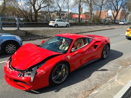 A gutted Ferrari owner crashed his brand new £250,000 supercar after driving it for just two miles.

The driver, who was uninjured, was left counting the cost after his car was involved in the collision shortly after he purchased it in Derby on Friday.

Photos shared by police show the front bonnet crumpled with scratches all across the front of the red sports car.

The luxury motor is believed to be a Ferrari 488.